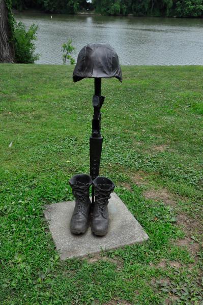 boots and a helmet sculpture